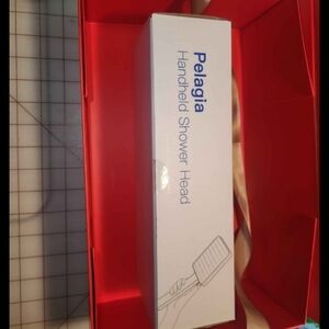 Pelagia Handheld Shower Head - White and Red Packaging